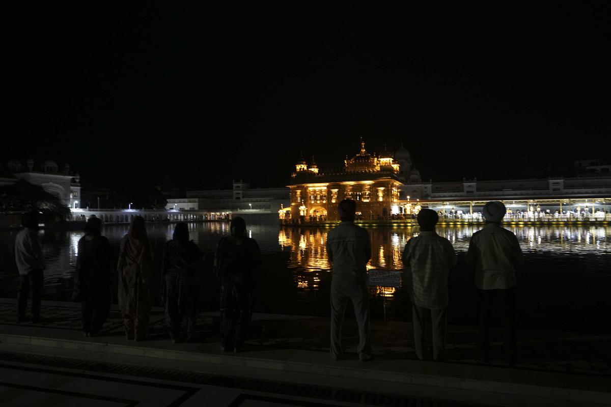 People at the golden temple during a blackout, amid escalating tension Between India and Pakistan, In Amritsar, Punjab, On May 8, 2025. People at the golden temple during a blackout, amid escalating tension Between India and Pakistan, In Amritsar, Punjab, On May 8, 2025.