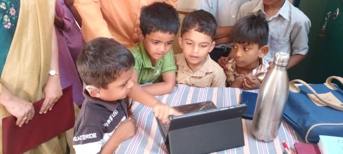Students with hearing impairment being trained in the use of Digitally Accessible Deaf tools at a school campus.