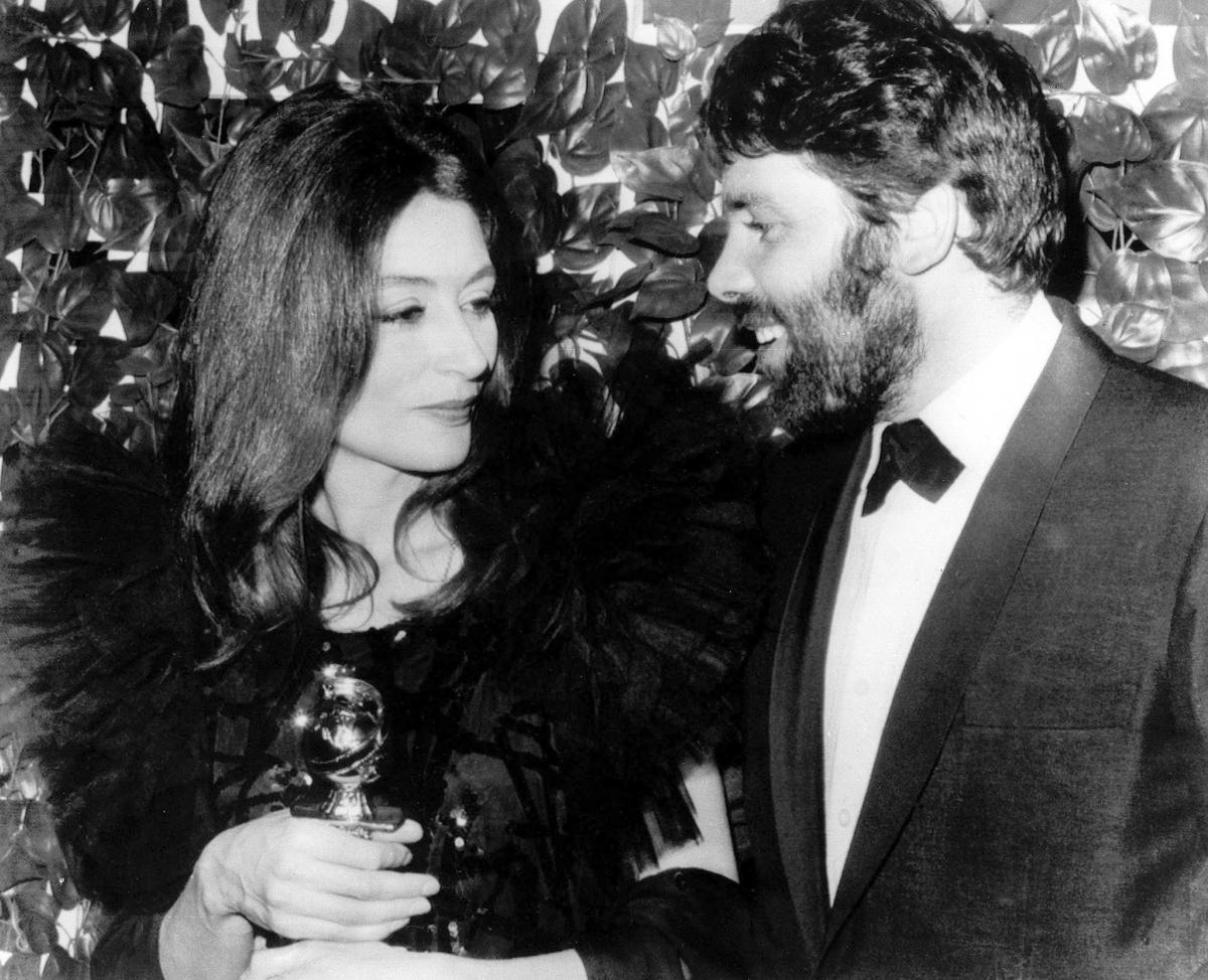 FILE - French actress Anouk Aimee poses with her husband, Lyricist Pierre Baruch, in Hollywood last night after the Hollywood foreign press association named her best actress of the year at the group’s annual Golden Globes Awards Banquet. She won in the Drama Category for her role in “A man and a woman” on Feb. 1967..The film was named best foreign language film of the Year.