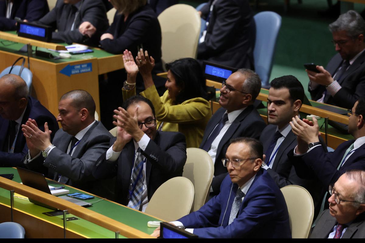 Diplomats applaud after the adoption of a draft resolution during an emergency special session of the U.N. General Assembly on the ongoing conflict between Israel and Hamas, at U.N. headquarters in New York City, U.S., October 27, 2023. 