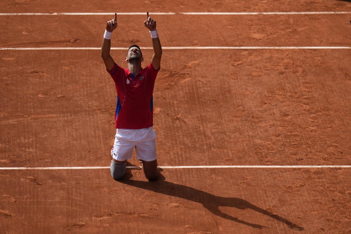 Serbia’s Novak Djokovic reacts after defeating Spain’s Carlos Alcaraz in the men’s singles tennis final at the Roland Garros Stadium during the 2024 Summer Olympics, Sunday, Aug. 4, 2024, in Paris, France.