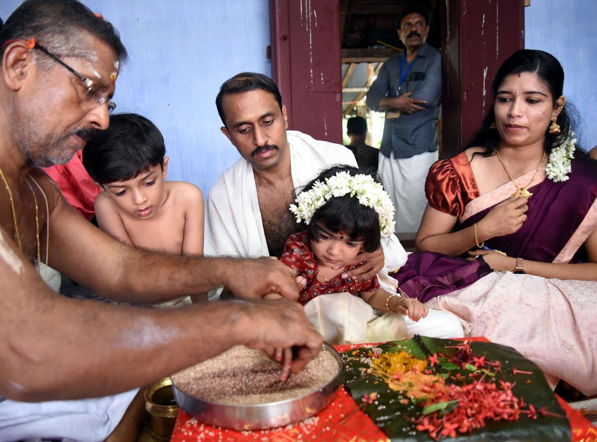 Vidyarambham ceremony in progress at Valayanad Devi temple in Kozhikode.