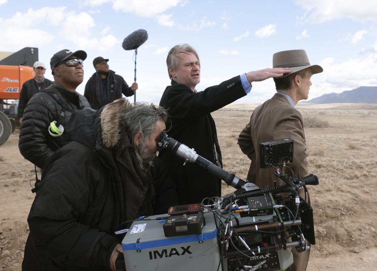 Director Christopher Nolan, center, and Cillian Murphy, right, on the set of ‘Oppenheimer’