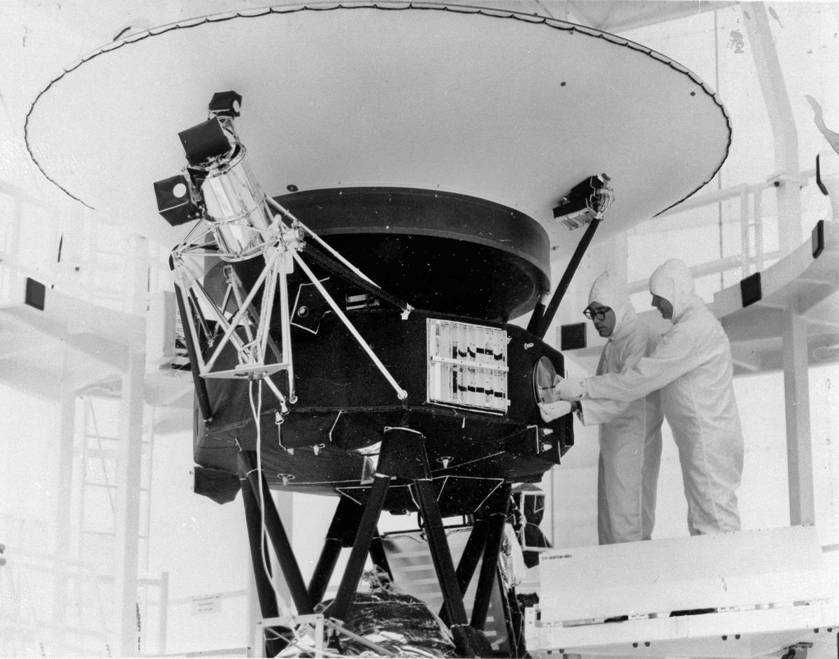 This August 1977 photo shows engineers working on the Voyager 2 spacecraft a few weeks before its launch on August 20. 