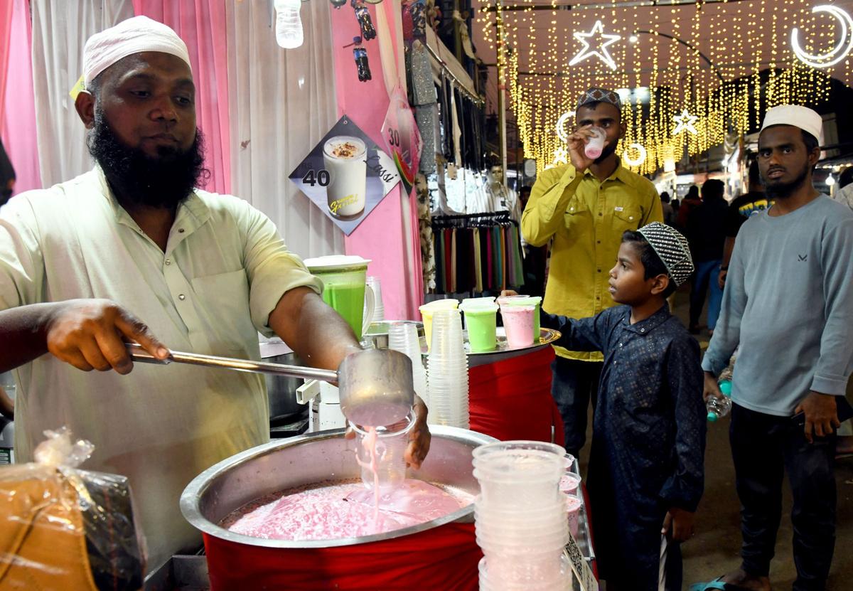 People relishing rooh afzah at a Ramzan food mela in Belagavi. 