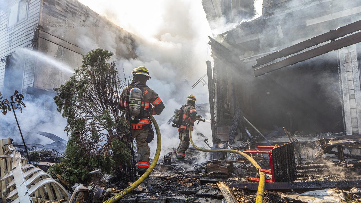 Three killed after small plane crashes into row of townhouses in Oregon, TV station reports