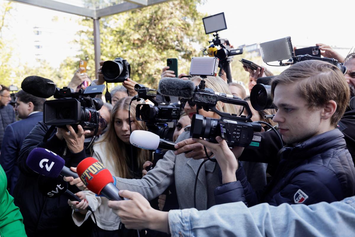 Members of the media wait for Joost Klein, representing the Netherlands, on the day of the Grand Final of the 2024 Eurovision Song Contest, outside a hotel in Malmö, Sweden, on May 11, 2024.