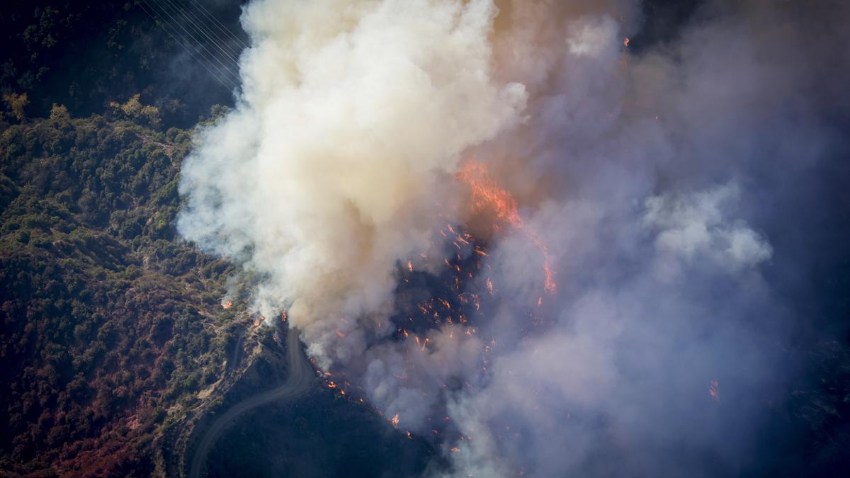 Firefighters race to contain Los Angeles wildfires with menacing winds forecast to return