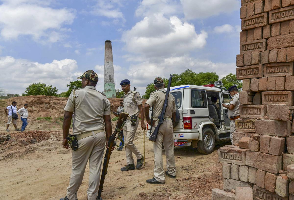 Police personnel at the abandoned brick kiln, where a key suspect in the murder of industrialist Gopal Khemka was killed in a gunfight with the police. Police personnel at the abandoned brick kiln, where a key suspect in the murder of industrialist Gopal Khemka was killed in a gunfight with the police.