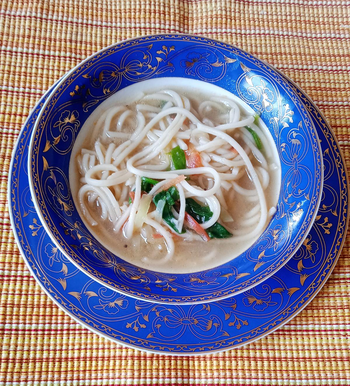 A steaming bowl of Vietnamese chicken noodles soup A steaming bowl of Vietnamese chicken noodles soup