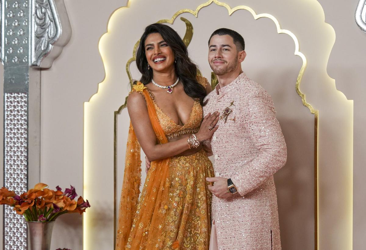 Mumbai: Actor Priyanka Chopra with her husband and singer Nick Jonas poses for photographs upon her arrival to attend Anant Ambani and Radhika Merchant’s wedding, in Mumbai, Friday, July 12, 2024