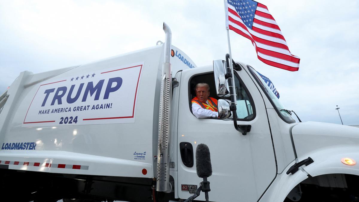 Donald Trump boards a garbage truck to draw attention to Biden remark