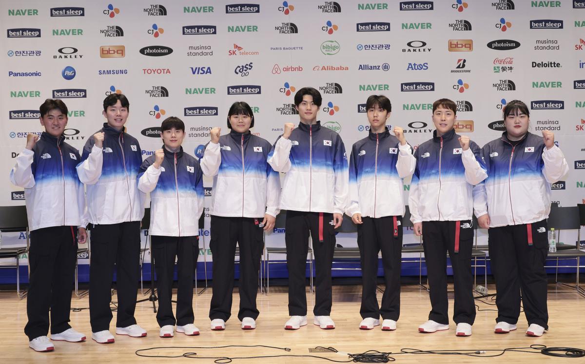 South Korean national team members wear uniforms for the medal ceremony for the Paris 2024 Olympic Games.