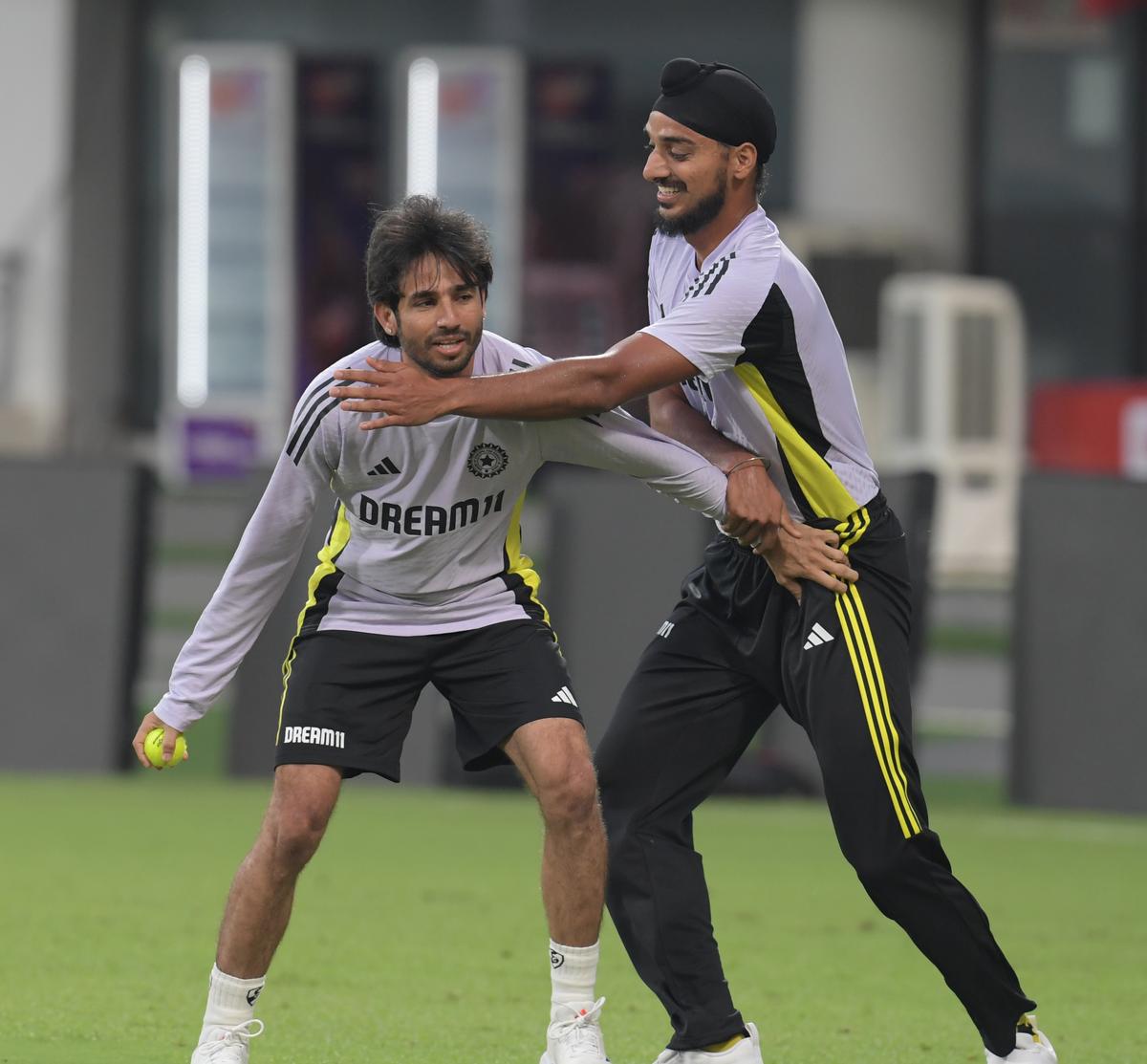 Ravi Bishnoi and Arshadeep Singh  during the practice session ahead of the India vs England second T20 match at the MAC Stadium in Chennai on Friday.