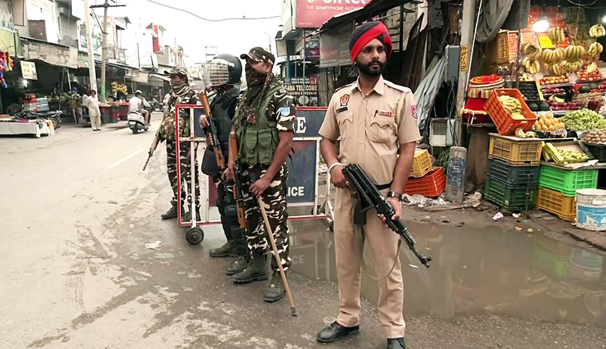Paramilitary personnel stand guard at Mehatpur village after the arrest of associates of Waris Punjab De chief Amritpal Singh, in Jalandhar on Saturday.