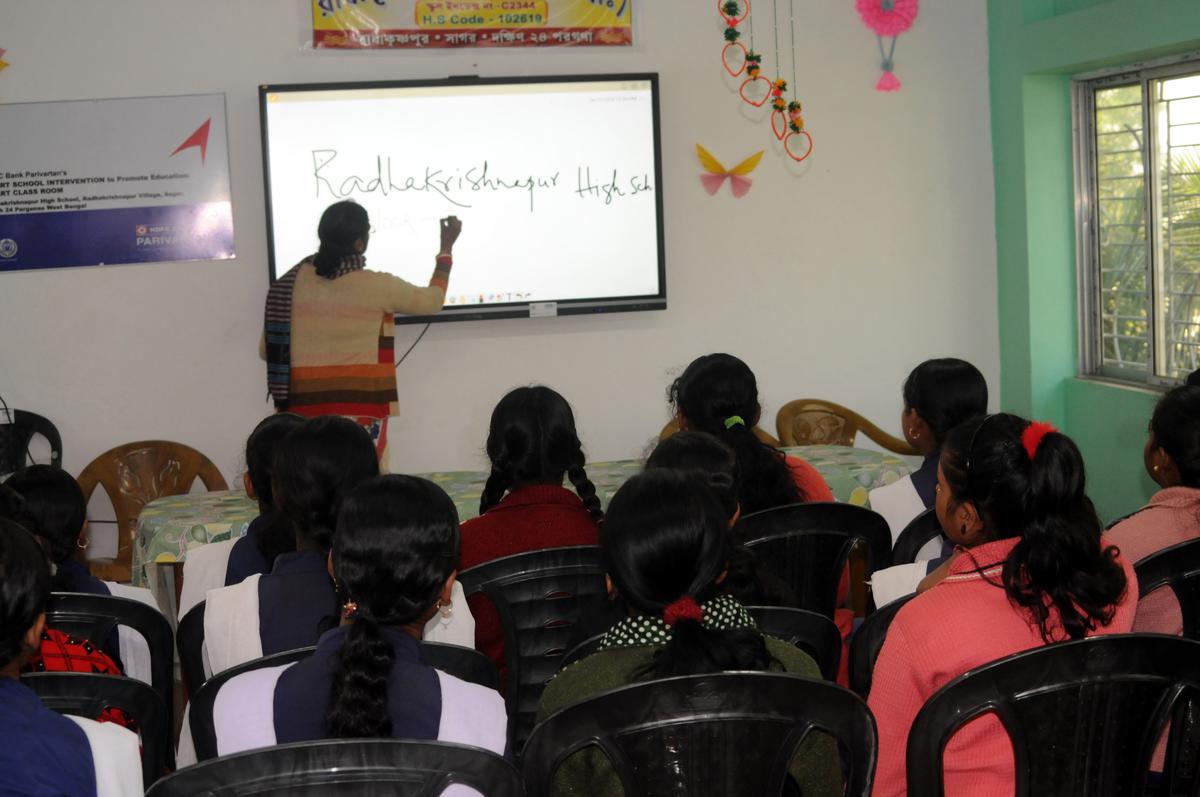 The smart classroom in Radhakrishnapur High School with an LED board that students can browse the internet on and teachers can use as a blackboard.  