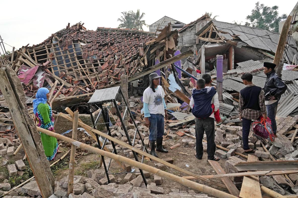 People inspect the ruins of their houses badly damaged in Monday’s earthquake in Cianjur, West Java, Indonesia on November 22, 2022.