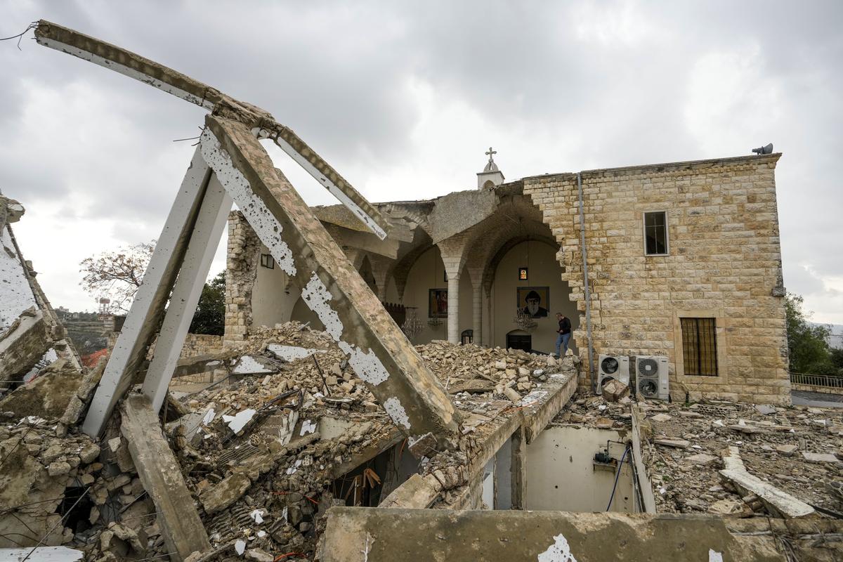 Georges Elia walks on the debris of the St. George Melkite Catholic Church on December 22, 2024.