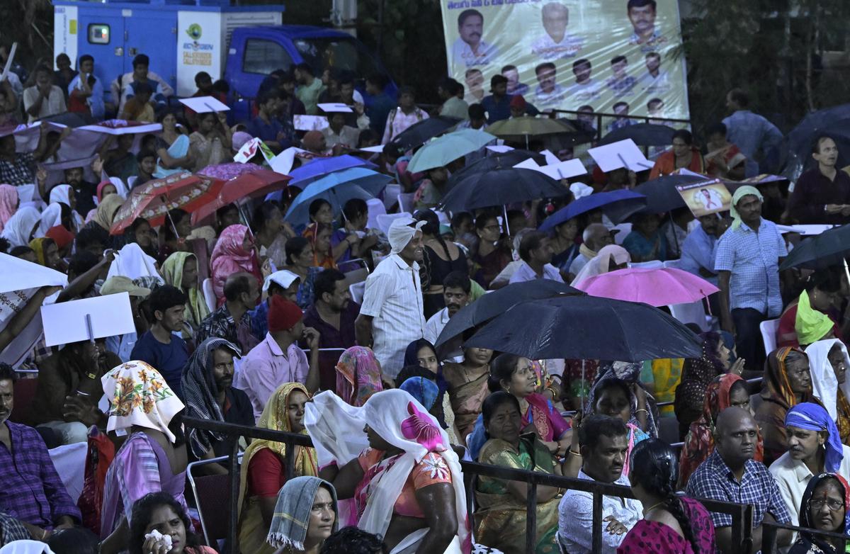 Film workers brave the rain as Chief Minister A. Revanth Reddy addresses them at Police Grounds in Hyderabad on Tuesday. 