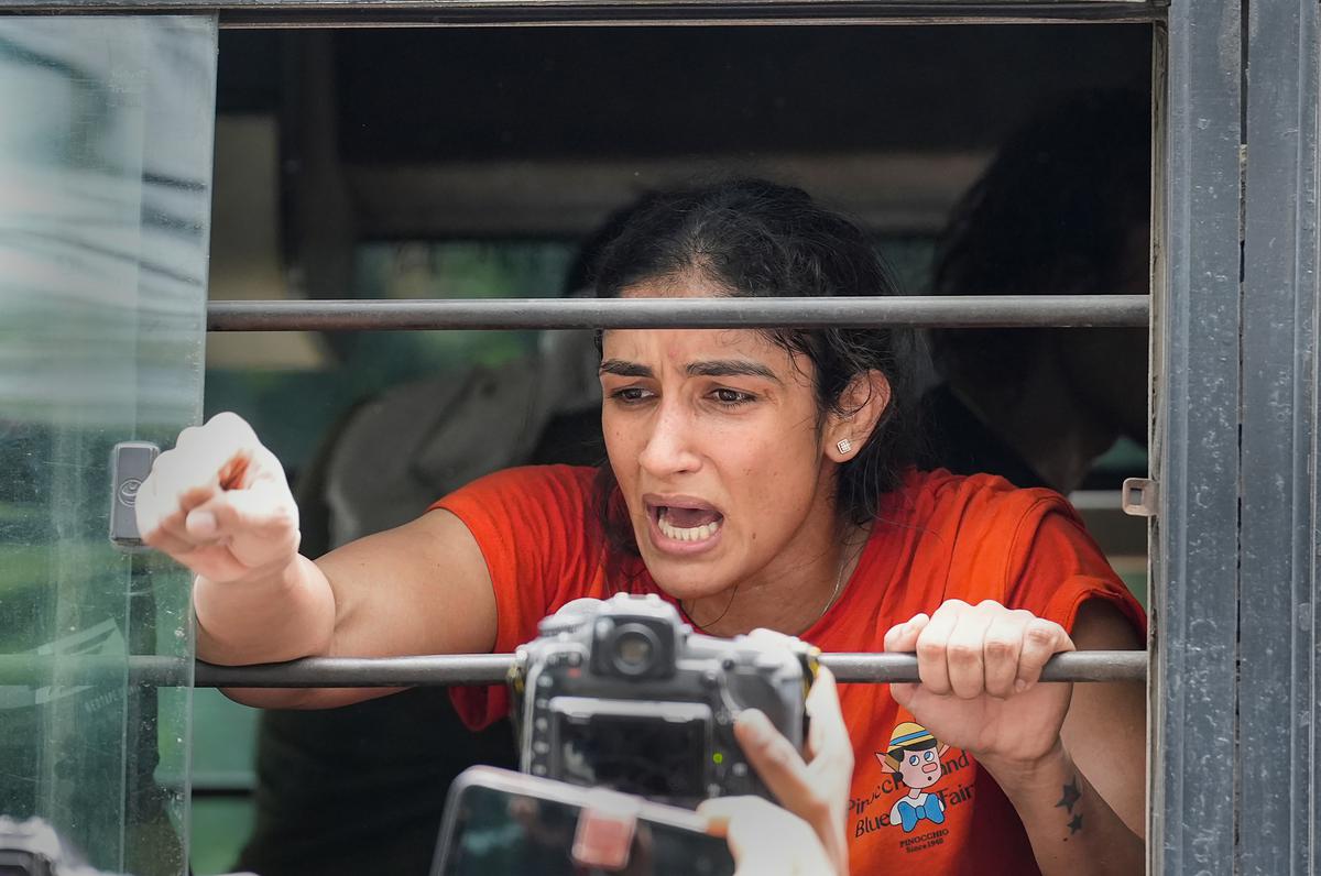 Wrestler Sangeeta Phogat after being detained by police during wrestlers’ protest march towards new Parliament building in New Delhi on May 28, 2023.