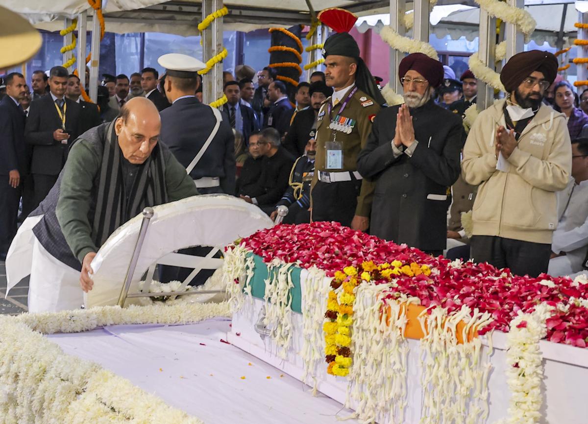  Defence Minister Rajnath Singh pays his last respects to former prime minister Manmohan Singh during the latter’s state funeral, at the Nigambodh Ghat, in New Delhi, Saturday, Dec. 28, 2024. 