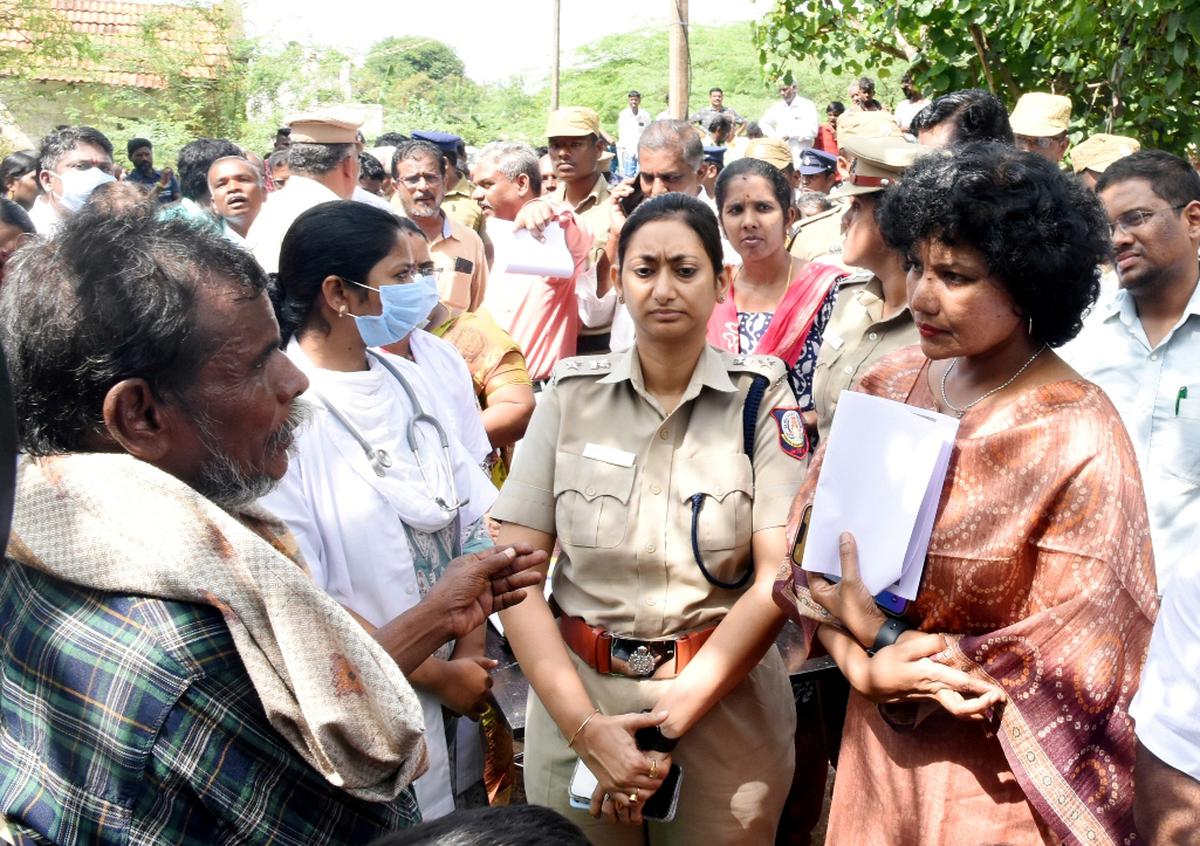 Pudukottai Collector Kavitha Ramu interacting with a village residend at Vengaivayal, a day after the incident of faeces found in the water tank last month Pudukottai Collector Kavitha Ramu interacting with a village residend at Vengaivayal, a day after the incident of faeces found in the water tank last month