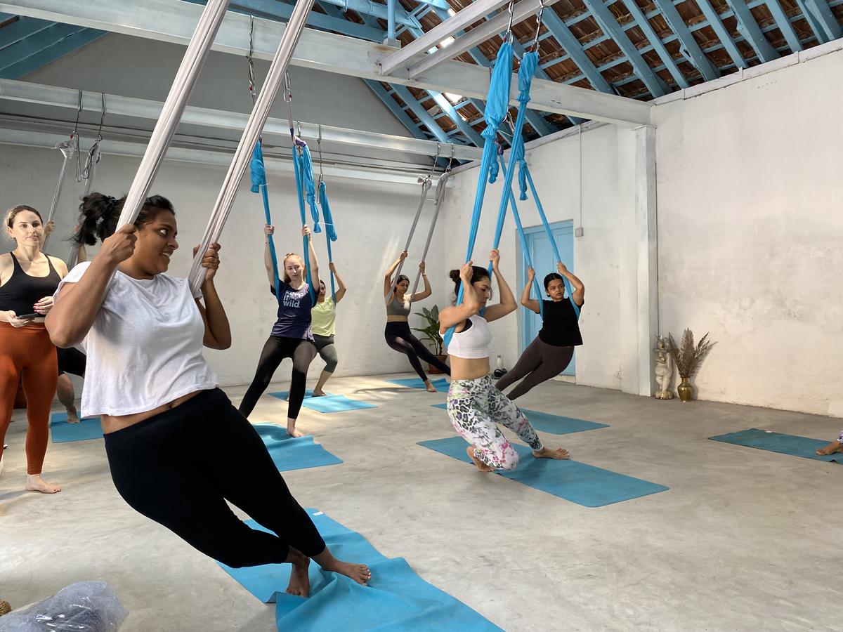 What is Aerial Yoga? Benefits, Best Poses and more (2023)