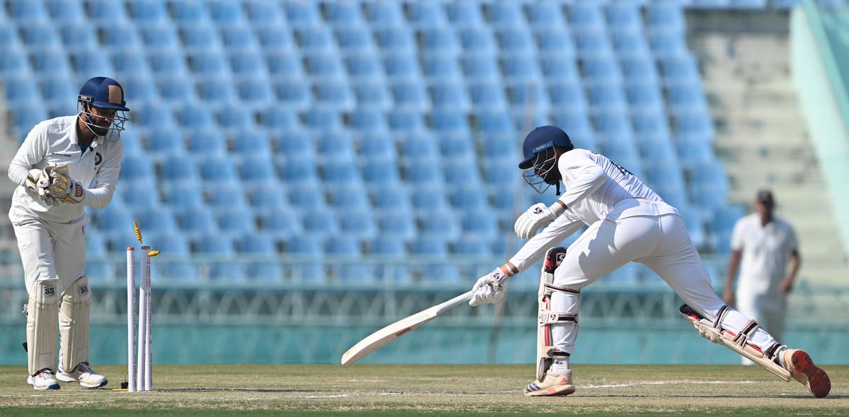 Karnataka’s R. Smaran is stumped by Saurabh Rawat off Mayank Mishra.