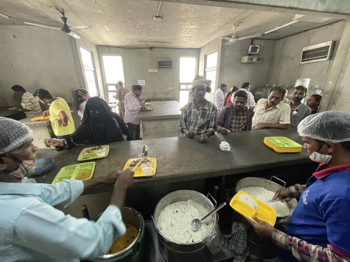 A file photo of people having food in the Indira Canteen at K.R. Market bus stand, in Bengaluru. 