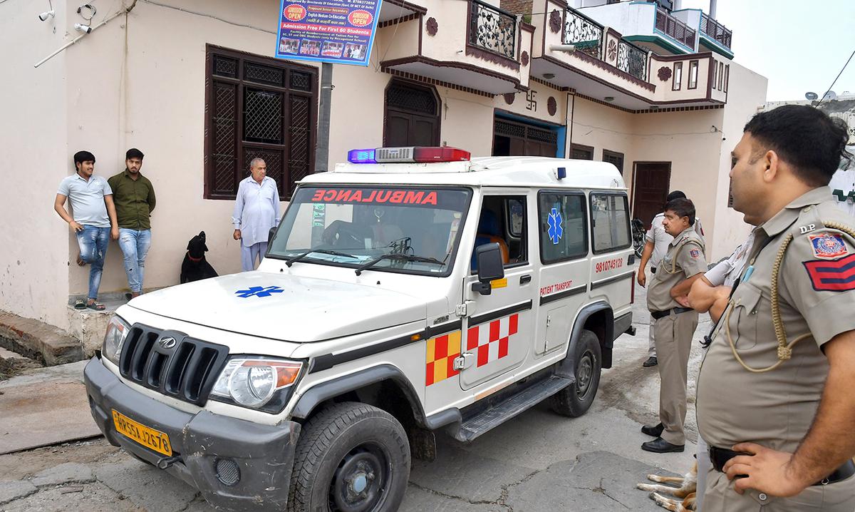 An ambulance carrying the body of gangster Sunil Balyan alias Tillu Tajpuriya in Tajpur Kalan village.