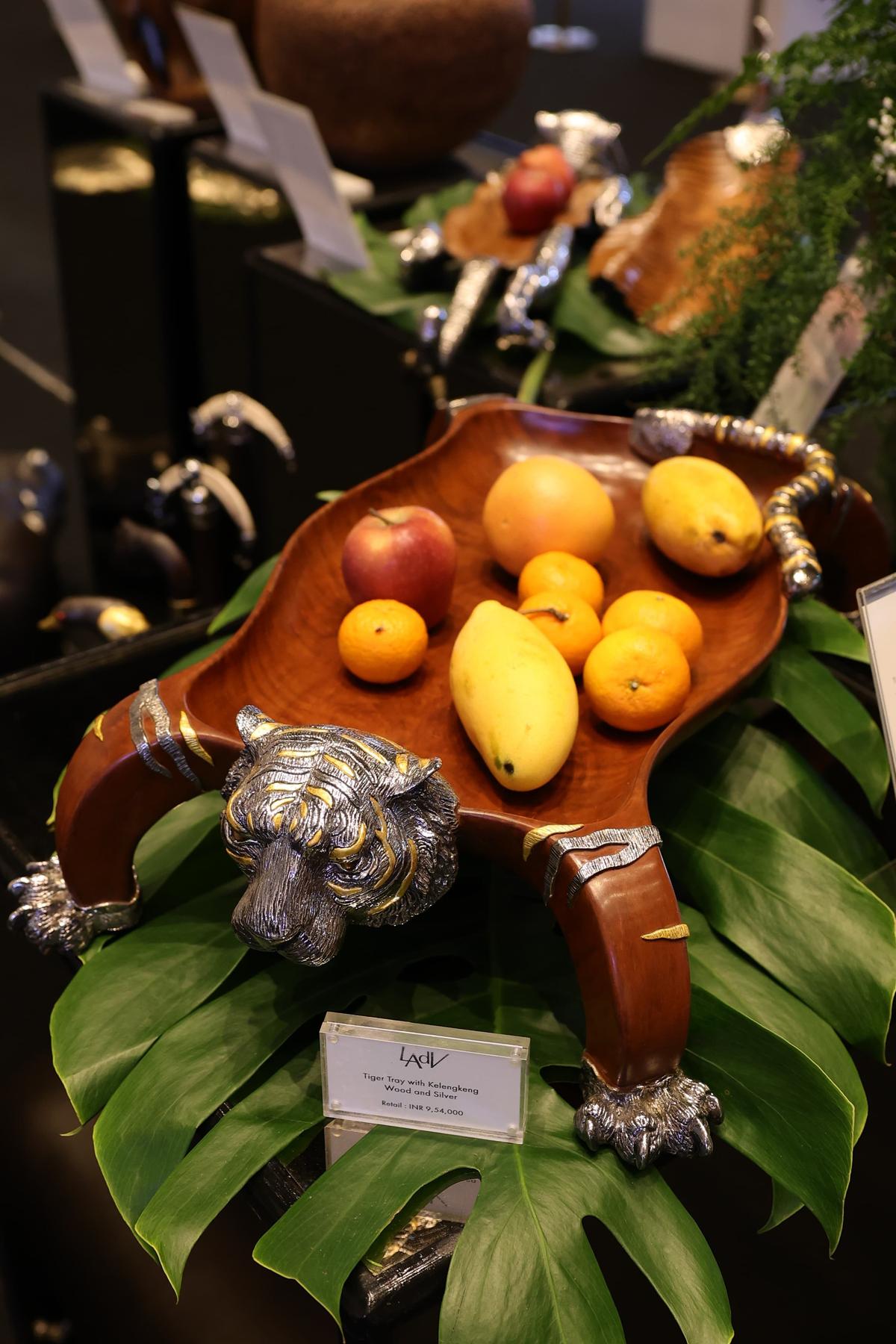 Decorative pieces by art and decor brands (such as the serving platter from Lotus Arts de Vivre) were displayed along the periphery.