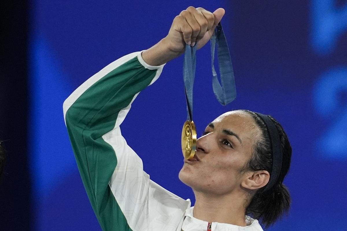 Gold medalist Algeria’s Imane Khelif kisses her medal for the women’s 66 kg final boxing match at the 2024 Summer Olympics on August 9, 2024, in Paris, France. 