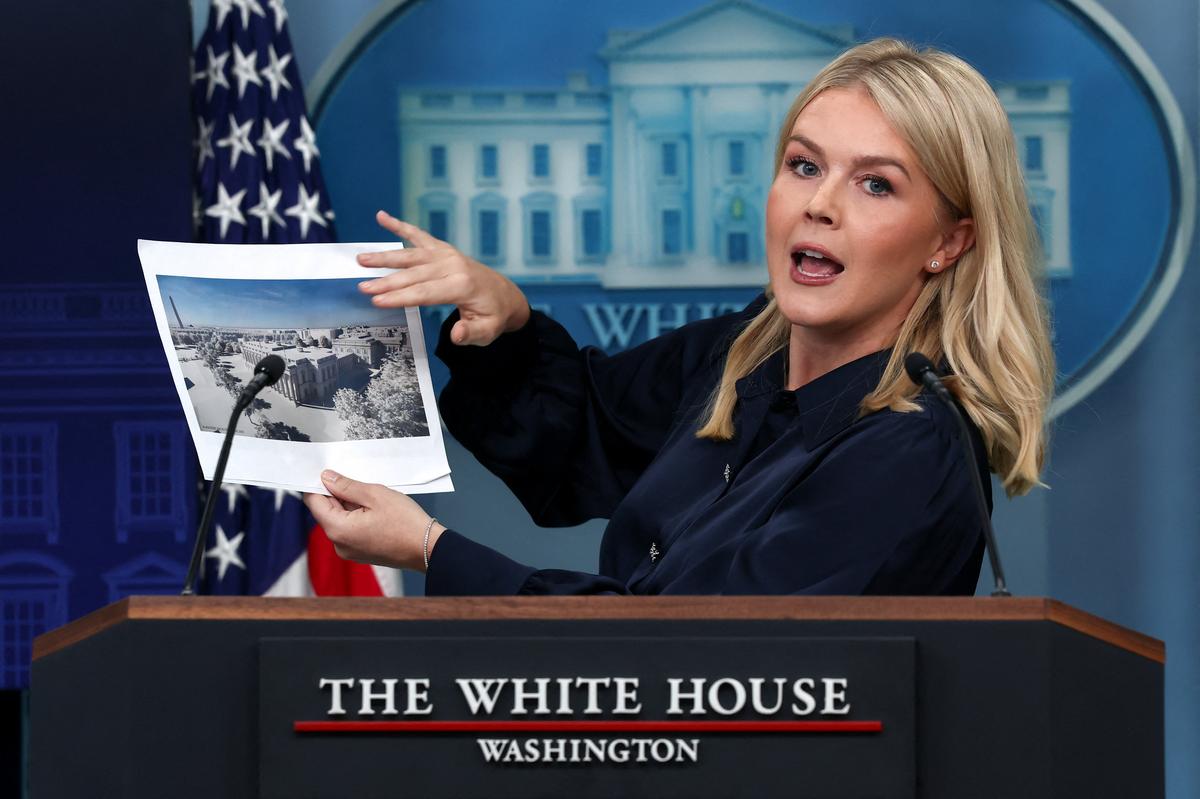 White House Press Secretary Karoline Leavitt holds an image of a rendering of the new White House ballroom to be built during a press briefing at the White House in Washington, D.C., on July 31, 2025. 