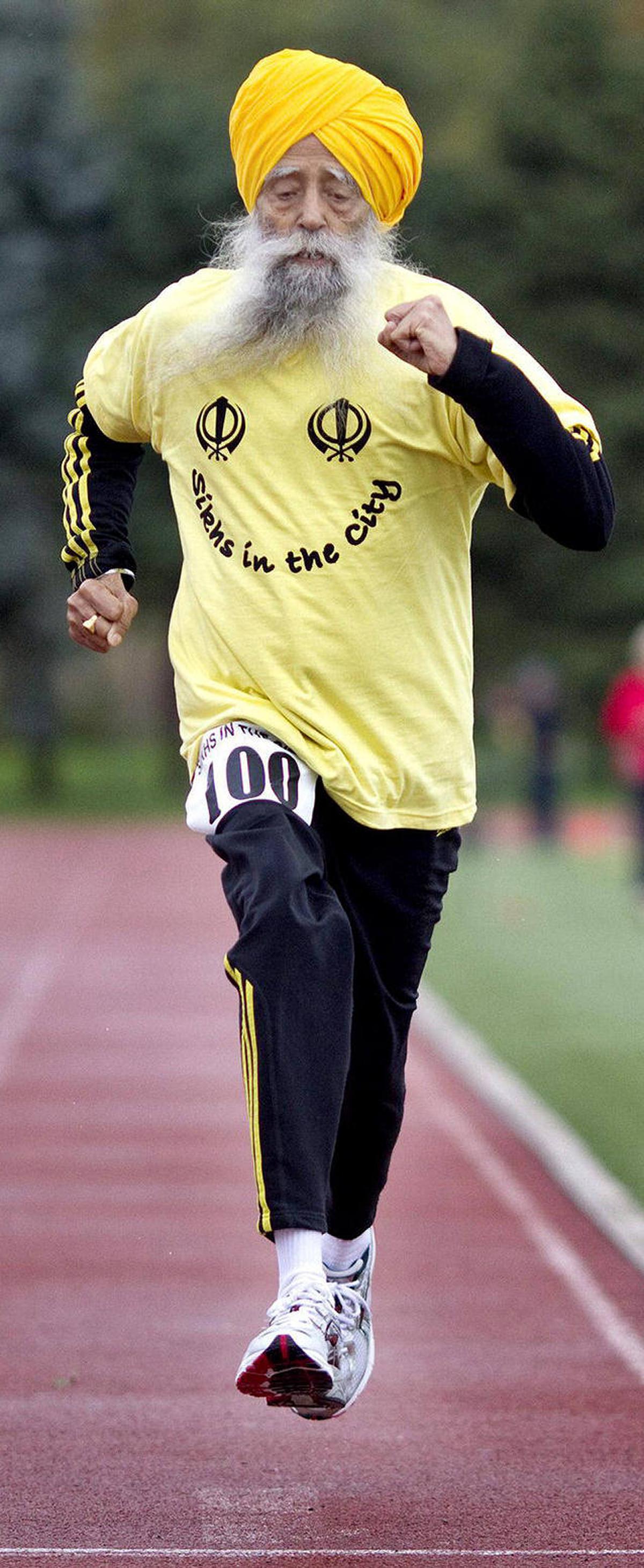 Fauja Singh crosses the finish line in a 100 meter race for centenarians in Toronto in 2011. Fauja Singh crosses the finish line in a 100 meter race for centenarians in Toronto in 2011.