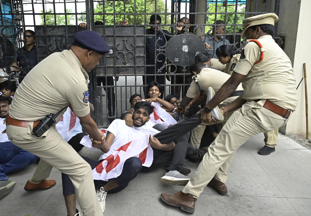 Police tackling the protesting members of Students Federation of India at Ministers’ quarters in Hyderabad on Tuesday.
