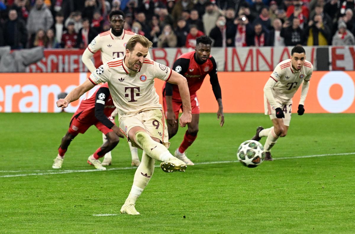 Bayern Munich’s Harry Kane scores their third goal from the penalty spot against Bayer Leverkusen