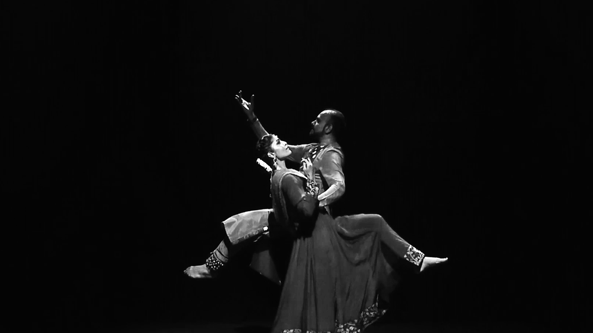 Dancer couple and their symbiotic movement on stage
