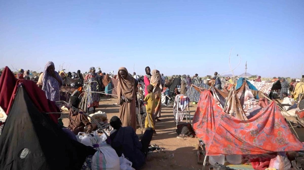 Displaced Sudanese gather and sit in makeshift tents on October 29, 2025 after fleeing Al-Fashir city in Darfur, in Tawila, Sudan, in this still image taken from a Reuters video.