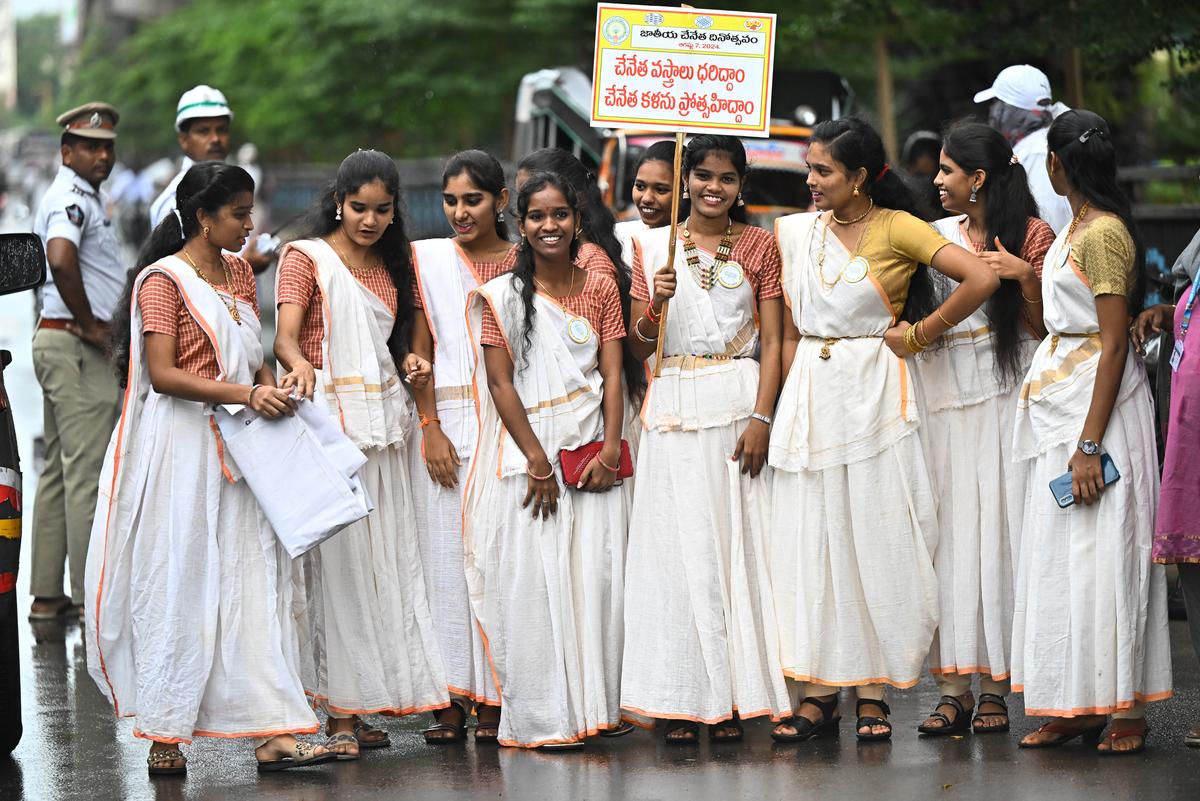 Youth in handloom garments taking part in a walk organised on the occasion of National Handloom Day in Vijayawada on Wednesday.