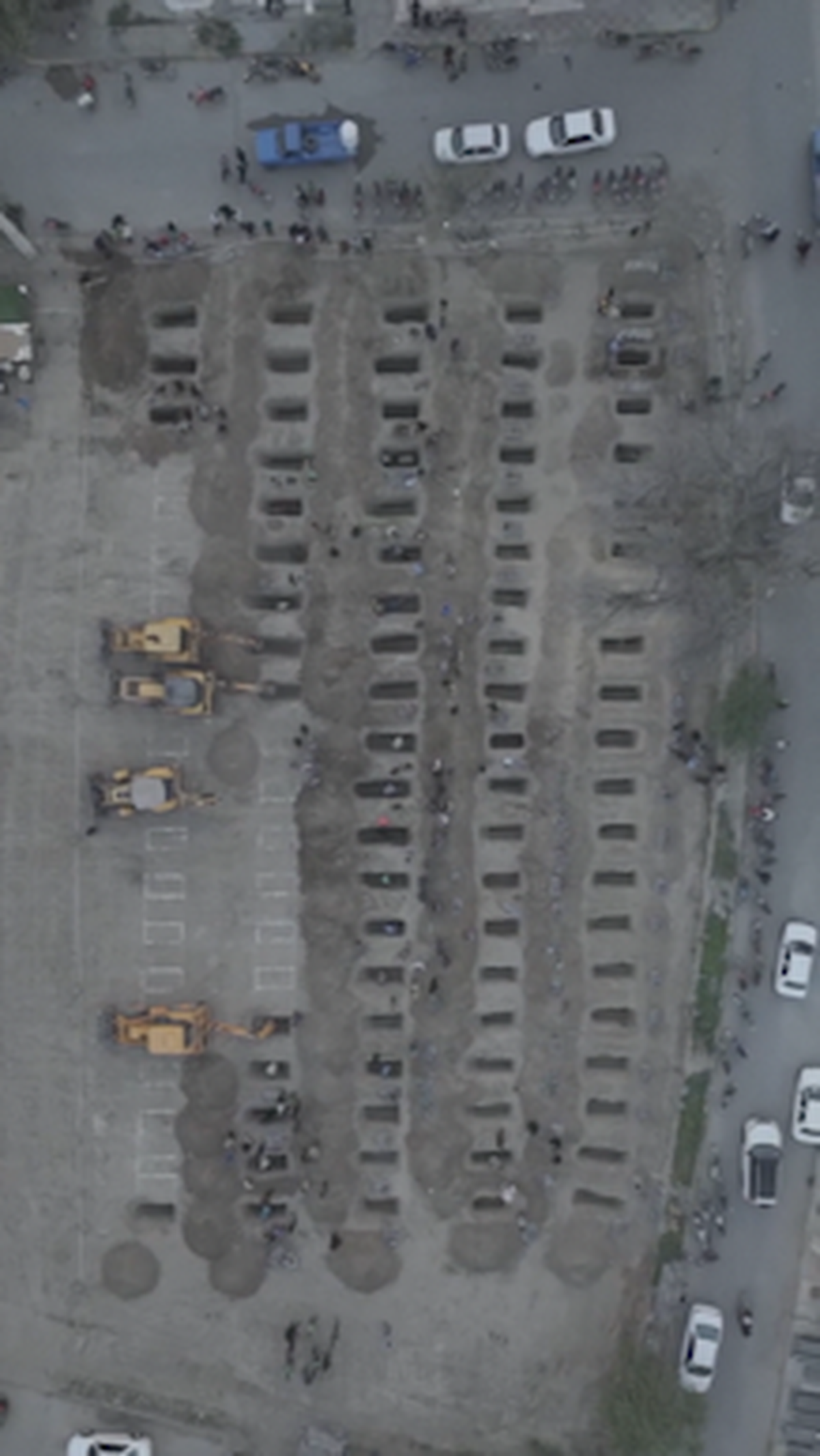 Watch: Drone shows grave site being prepared for victims of Iran school attack