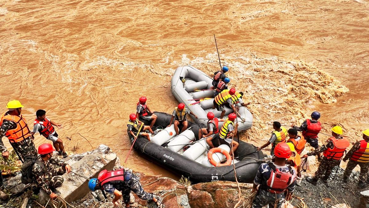 Rescuers in Nepal recover seven bodies after a landslide swept two buses of people into a river