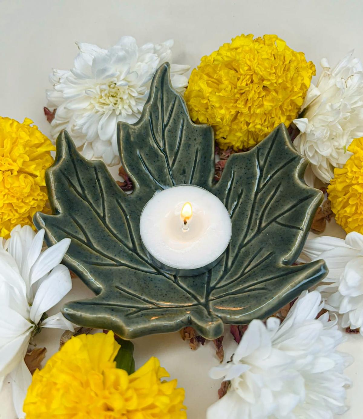 Maple-leaf ceramic diya by Reema Singh