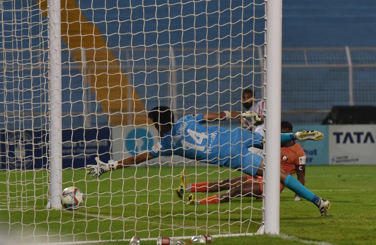 South United’s keeper makes an unsuccessful attempt to stop Bhupinder Singh’s strike in the Durand Cup football match between Namdhari and South United in Kolkata on July 30, 2025.