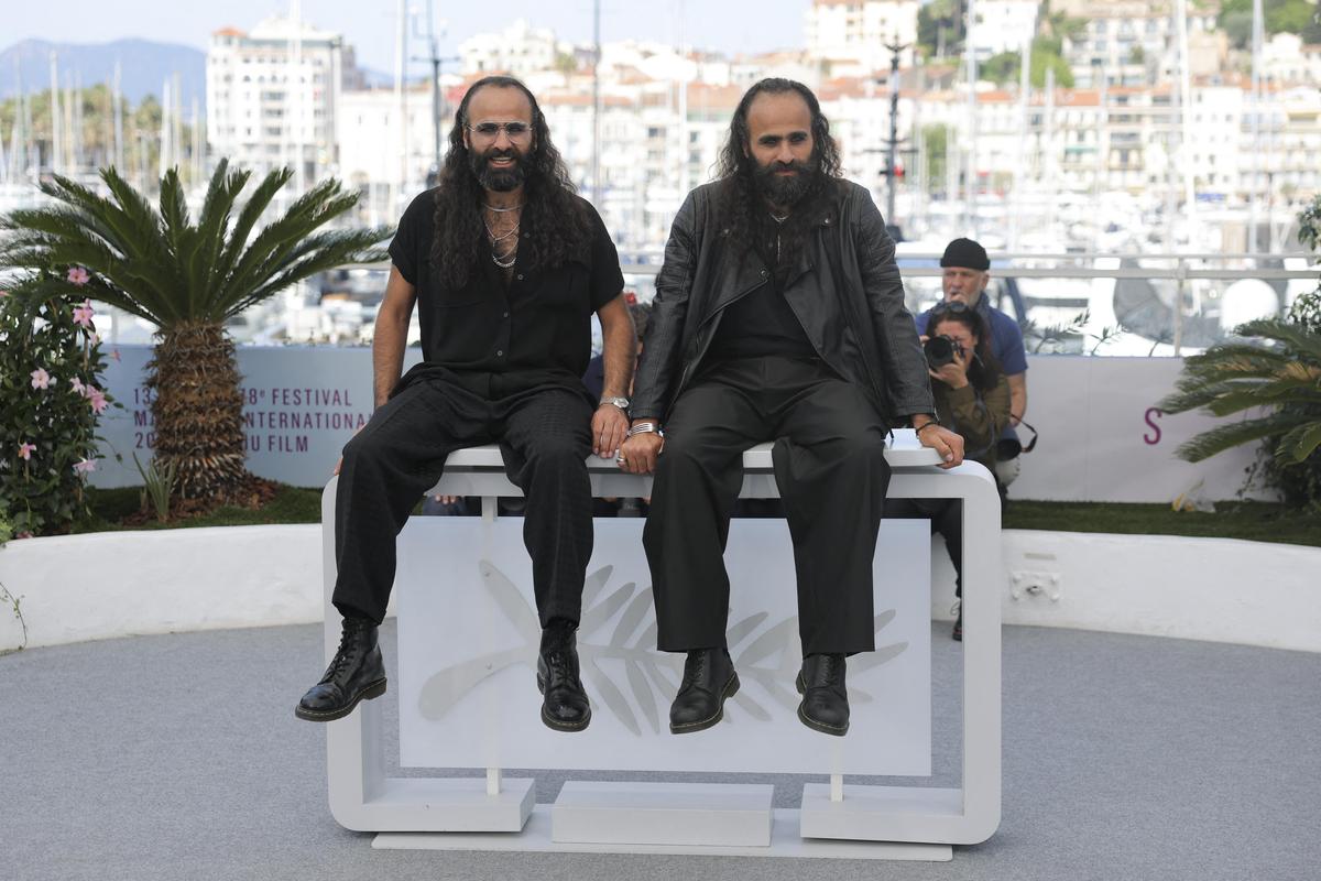 Directors Arab and Tarzan Nasser pose during a photocall for Once Upon a Time in Gaza