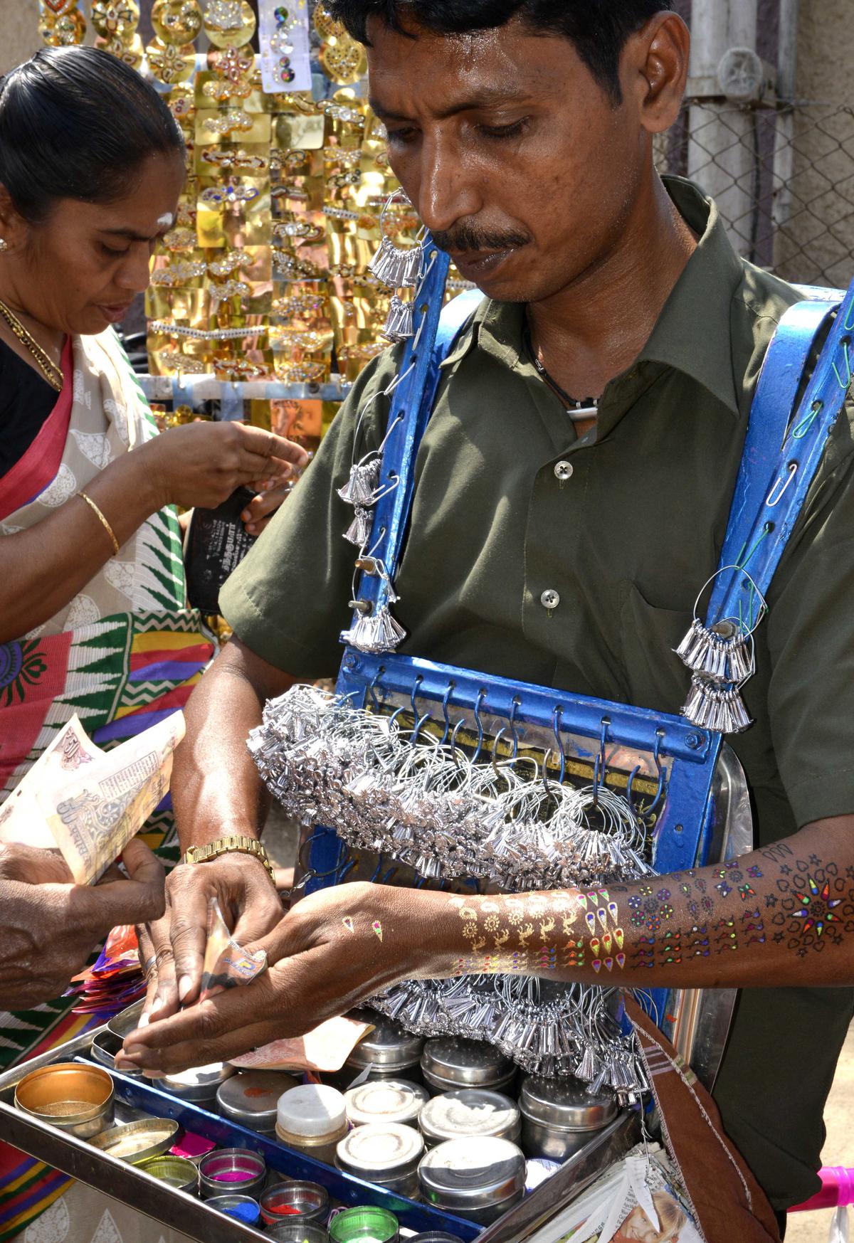 Street vendors doing brisk business on Raja Street