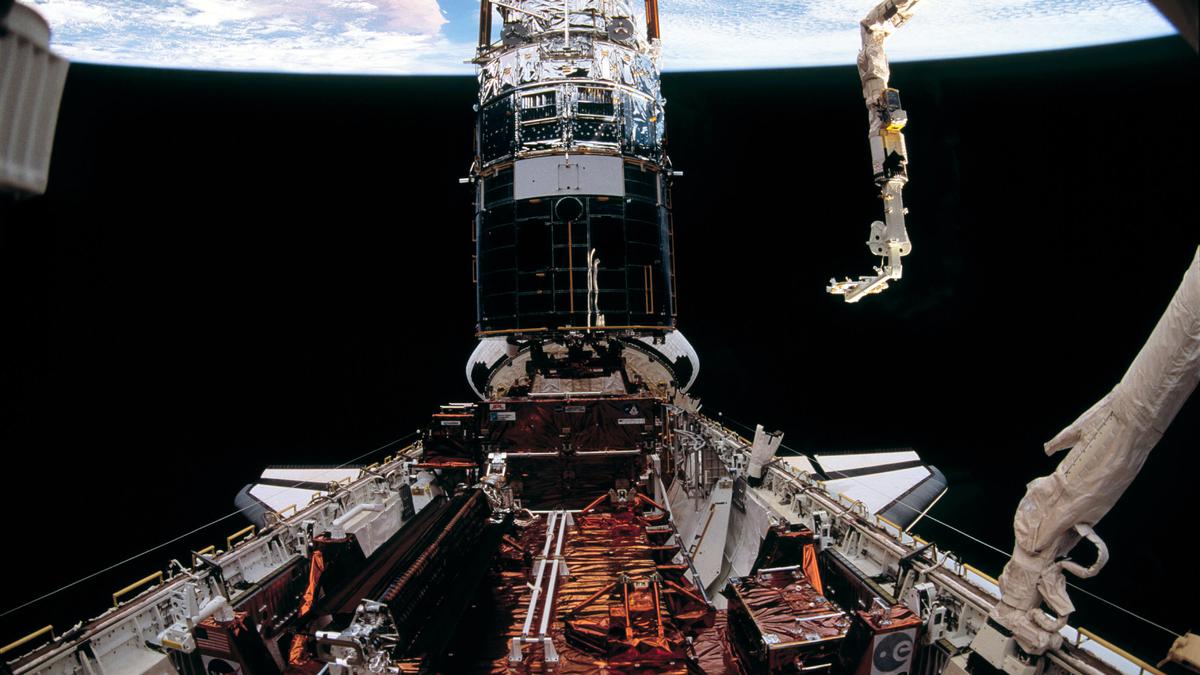 The first servicing mission to Hubble