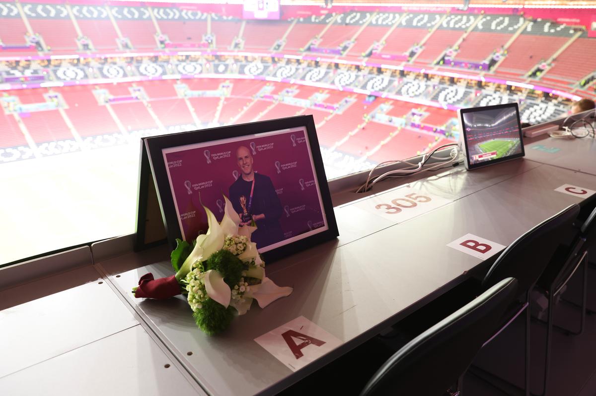 Flowers are placed in memory of Grant Wahl, an American sports journalist who passed away whilst reporting on the Argentina and Netherlands match, prior to the FIFA World Cup Qatar 2022 quarter final match between England and France at Al Bayt Stadium on December 10, 2022 in Al Khor, Qatar. 