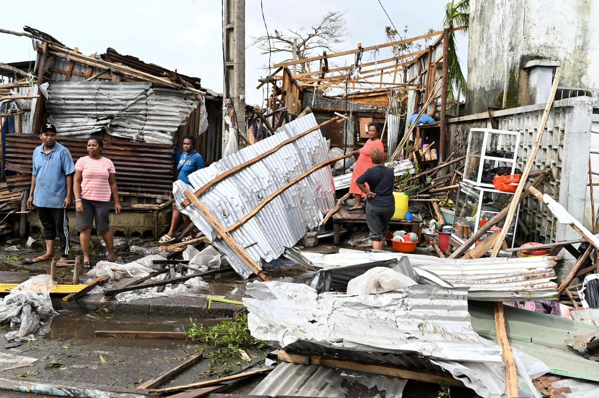 People survey the damage done by cyclone Gezina in Toamasina, Madagascar, on February 11, 2026