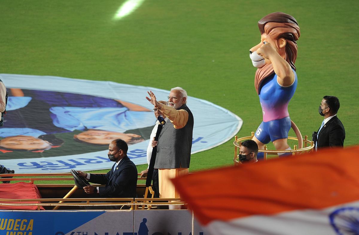 Prime Minister Narendra Modi during the inauguration of the 36th National Games at Narendra Modi Stadium in Ahmedabad. The official mascot for the National Games 2022- Savaj, the Asiatic lion, is also seen. 