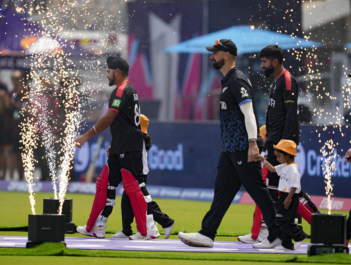 New Zealand's captain Daryl Mitchell and Canada's captain Dilpreet Bajwa, left, arrive on the field before the start of the ICC Men's T20 World Cup 2026 cricket match between New Zealand and Canada at the MA Chidambaram Stadium in Chennai, Tuesday, Feb. 17, 2026.